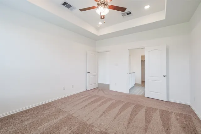 a view of a livingroom with a chandelier fan