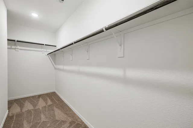 a view of a room with racks on the wall