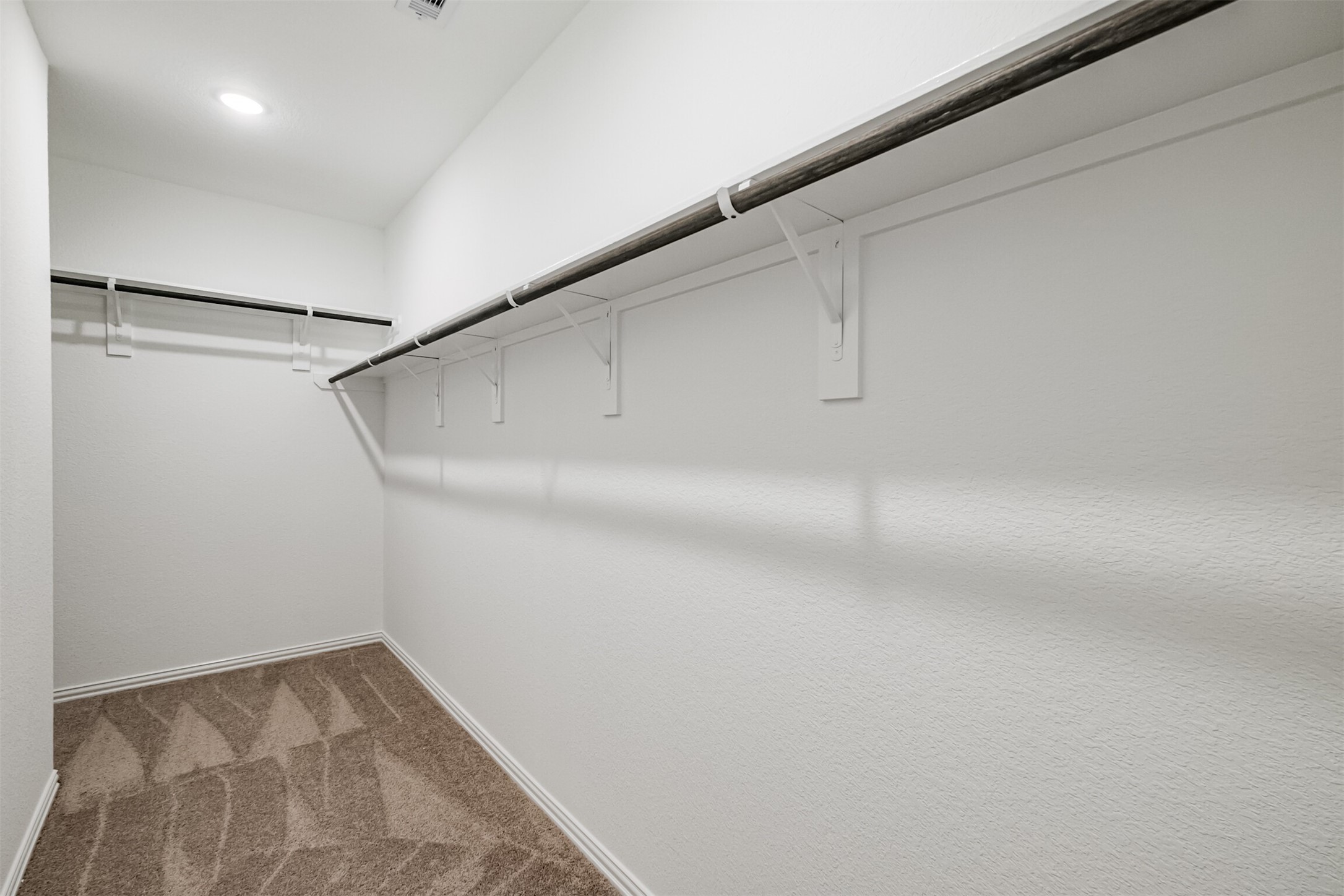 7922 Chukka Drive Fulshear, TX 77441 - Photo 25 of 39 a view of a room with racks on the wall