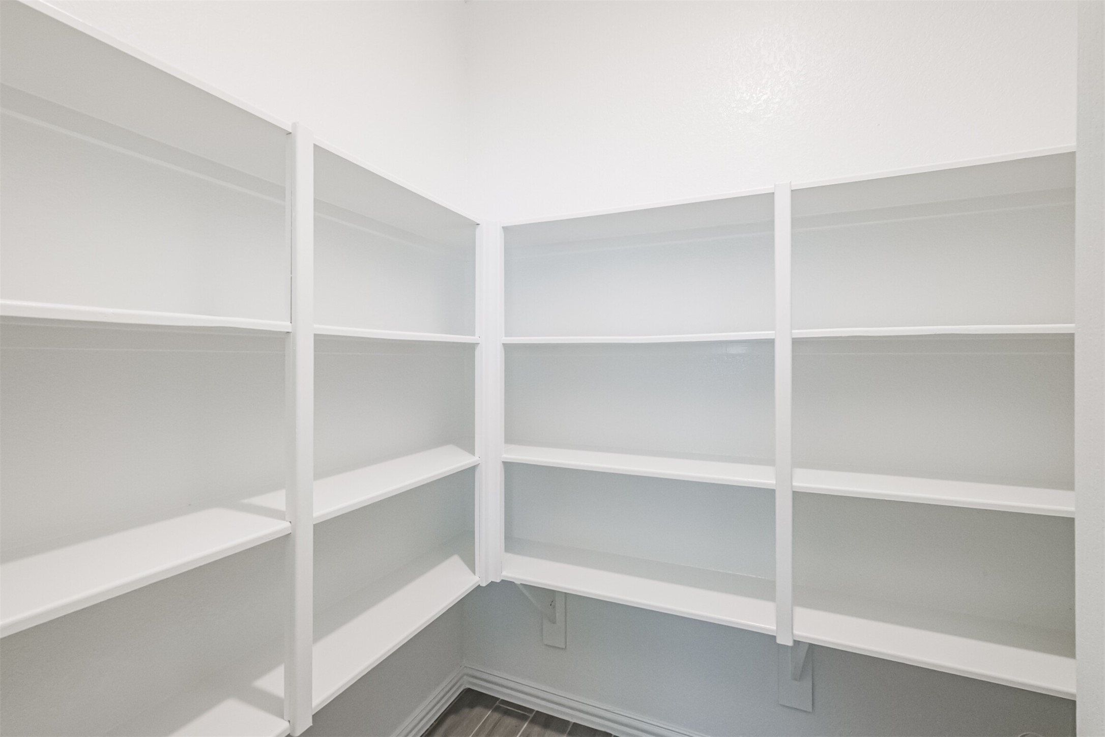 7922 Chukka Drive Fulshear, TX 77441 - Photo 26 of 39 a view of walk in closet with empty racks