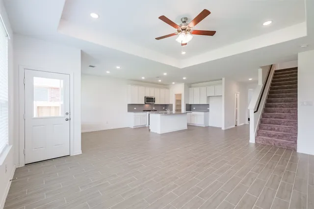 a view of kitchen with cabinets and wooden floor