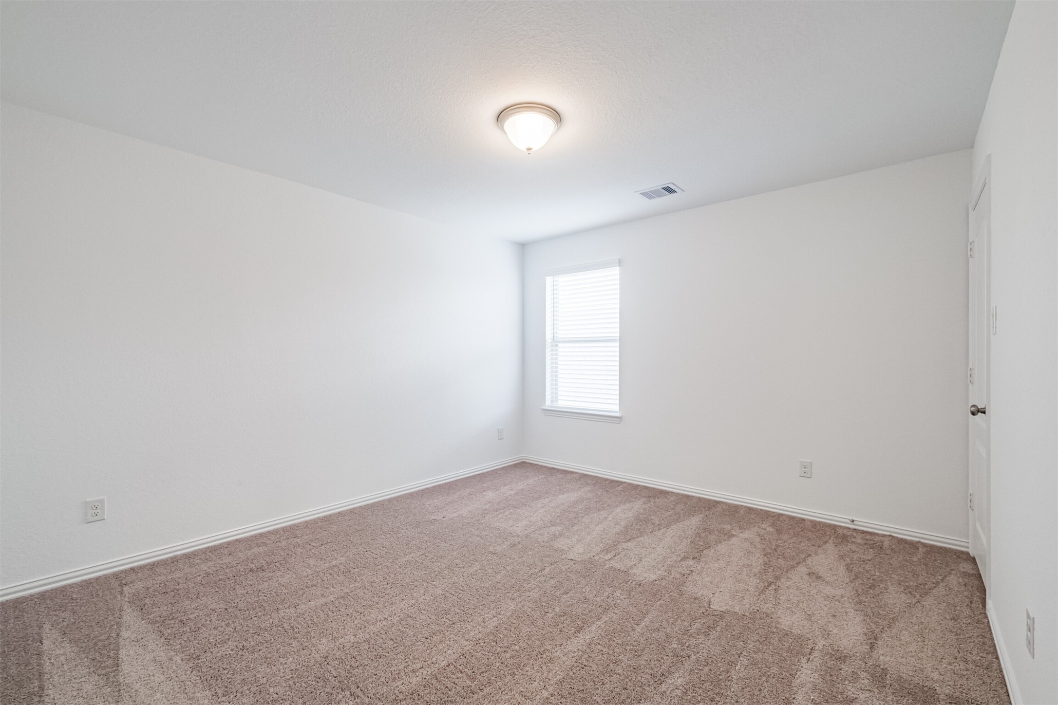 7922 Chukka Drive Fulshear, TX 77441 - Photo 28 of 39 an empty room with a window