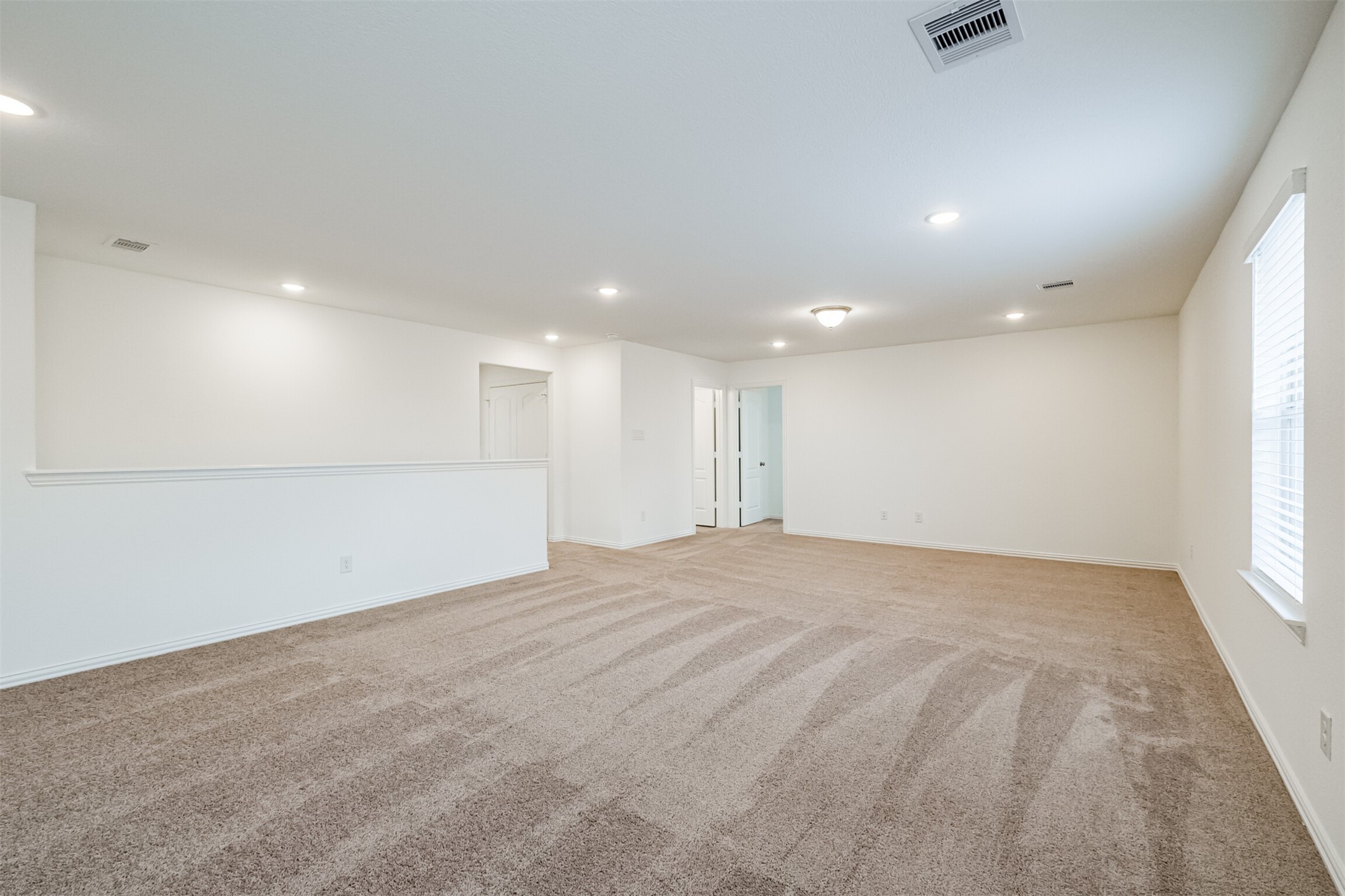 7922 Chukka Drive Fulshear, TX 77441 - Photo 29 of 39 a view of an empty room with a window