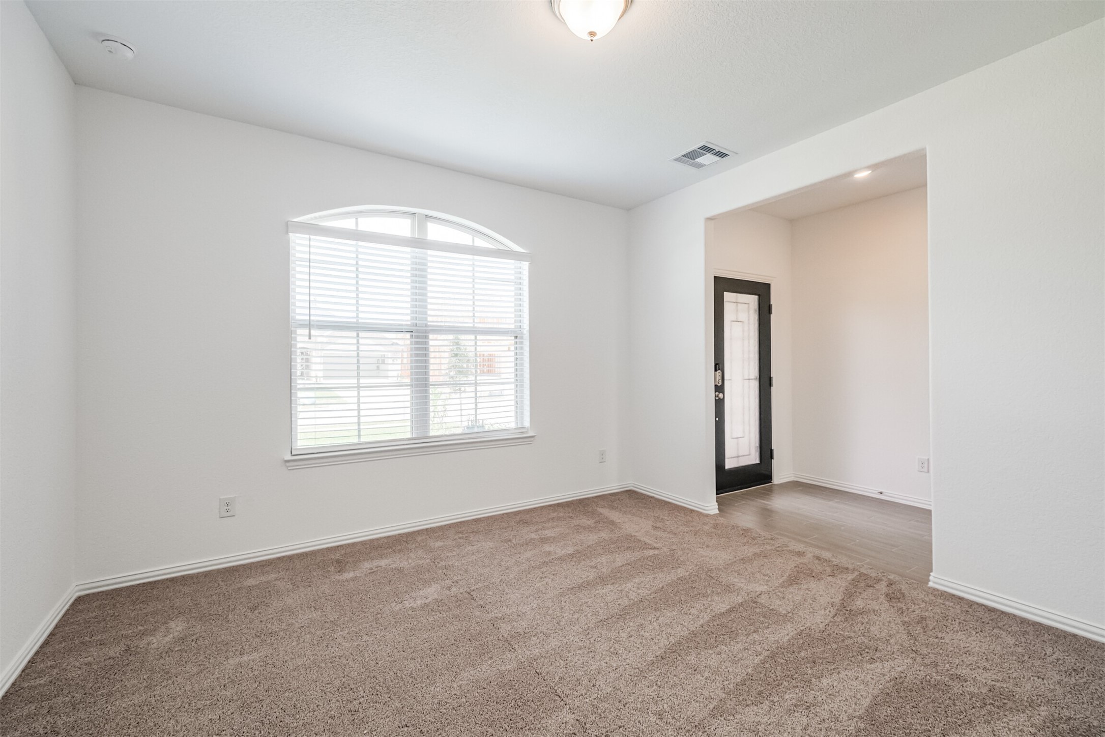 7922 Chukka Drive Fulshear, TX 77441 - Photo 30 of 39 an empty room with windows and closet