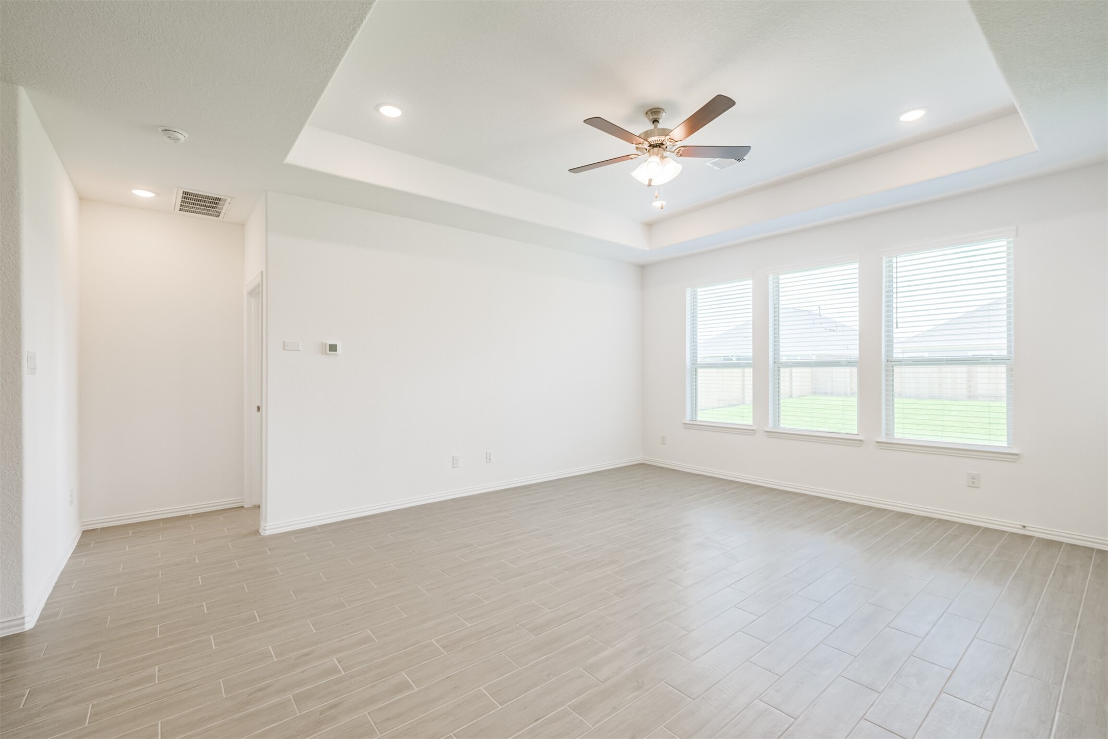 7922 Chukka Drive Fulshear, TX 77441 - Photo 32 of 39 wooden floor in an empty room with a window