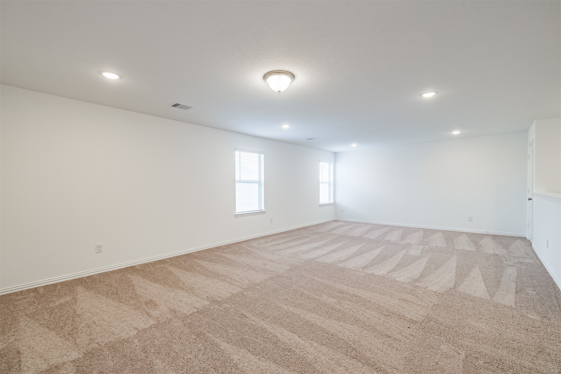 7922 Chukka Drive Fulshear, TX 77441 - Photo 4 of 39 an empty room with windows and closet