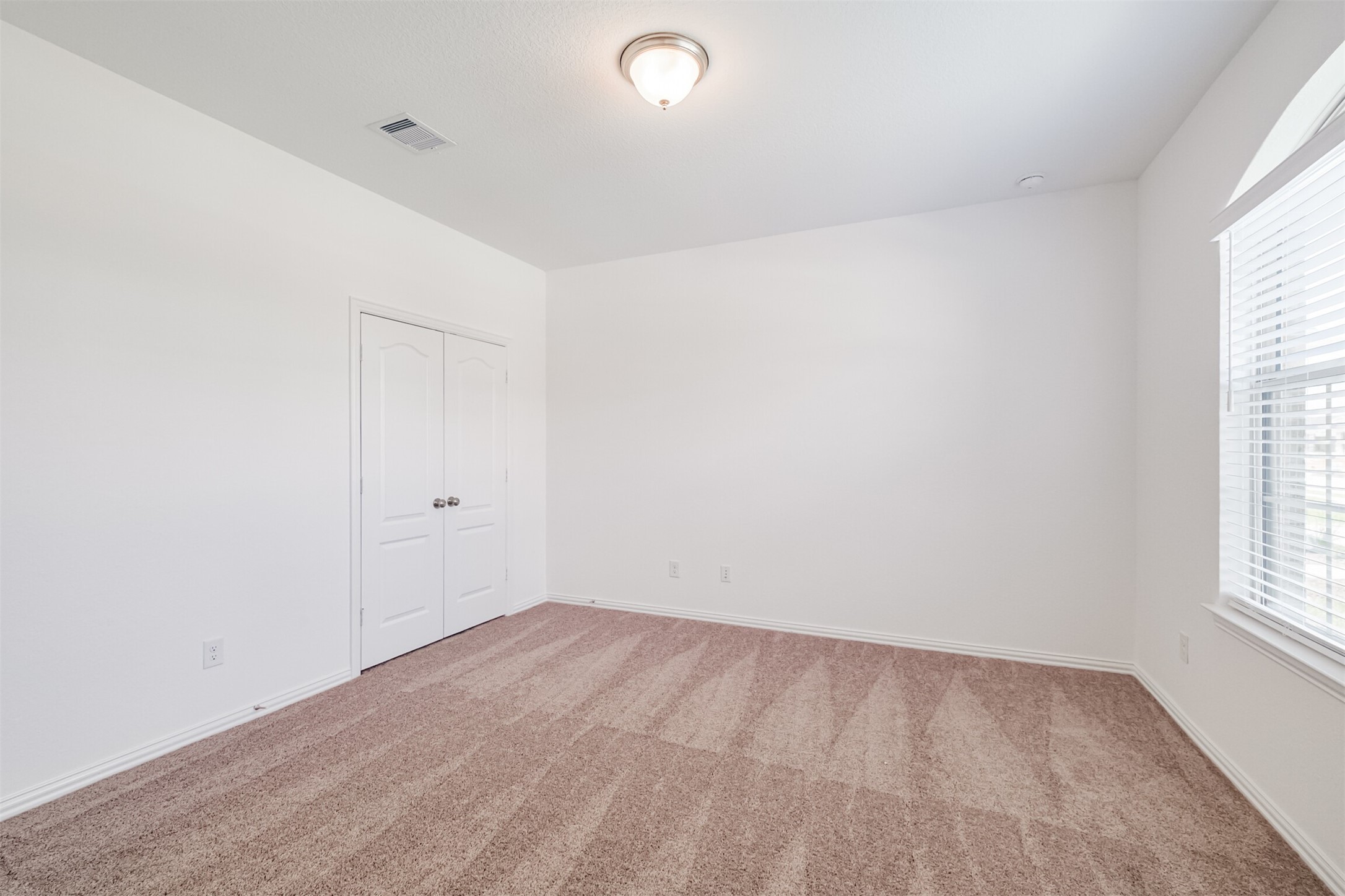 7922 Chukka Drive Fulshear, TX 77441 - Photo 8 of 39 an empty room with a window