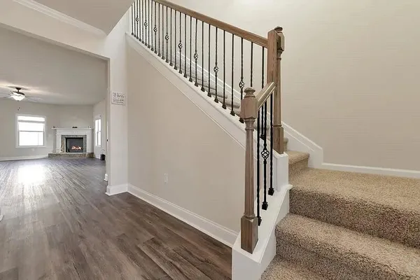 a view of entryway and hall with wooden floor