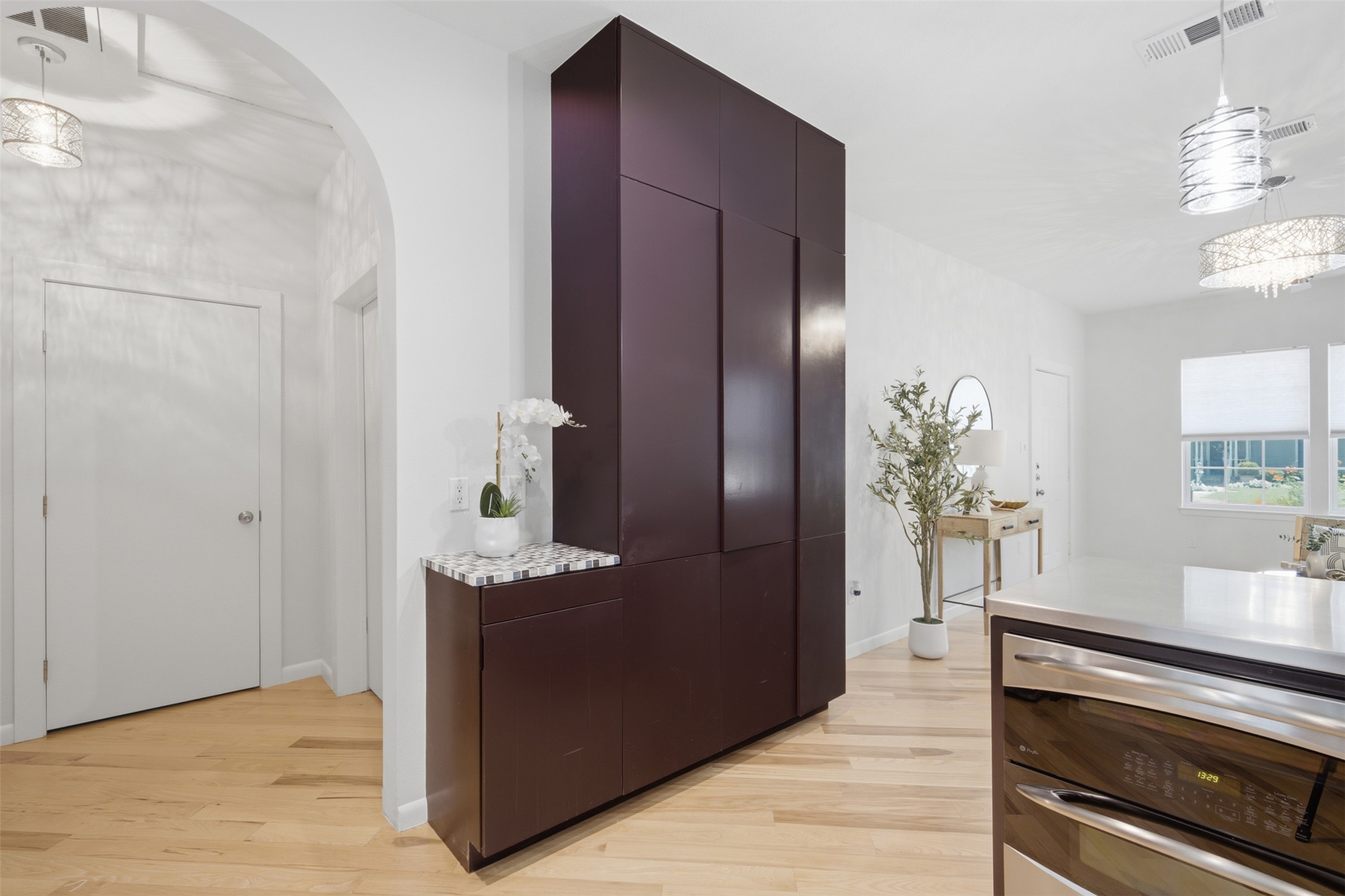 206 East 43rd Street Austin, TX 78751 - Photo 14 of 29 Floor to ceiling cabinets that offers additional storage in the kitchen area.