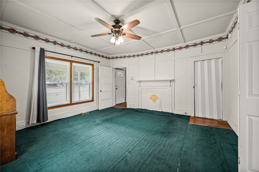 47 Square Street Pelzer, SC 29669 - Photo 20 of 29 An elegant coffered ceiling and classic fireplace mantel define this versatile bedroom.