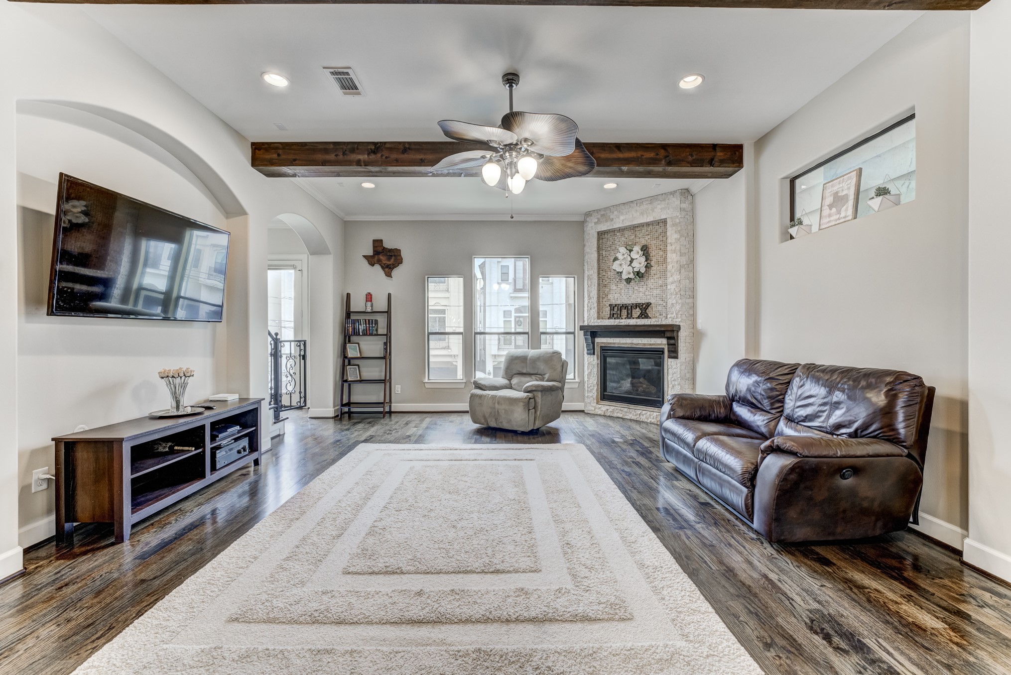 2308 Couch Street Houston, TX 77008 - Photo 11 of 50 a living room with furniture fireplace and flat screen tv