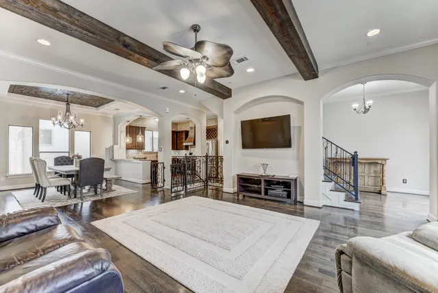 a kitchen with stainless steel appliances granite countertop a sink stove and cabinets