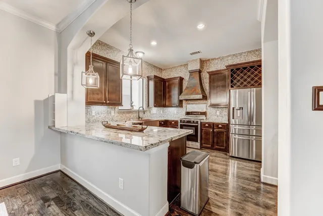 a bedroom with furniture and a flat screen tv