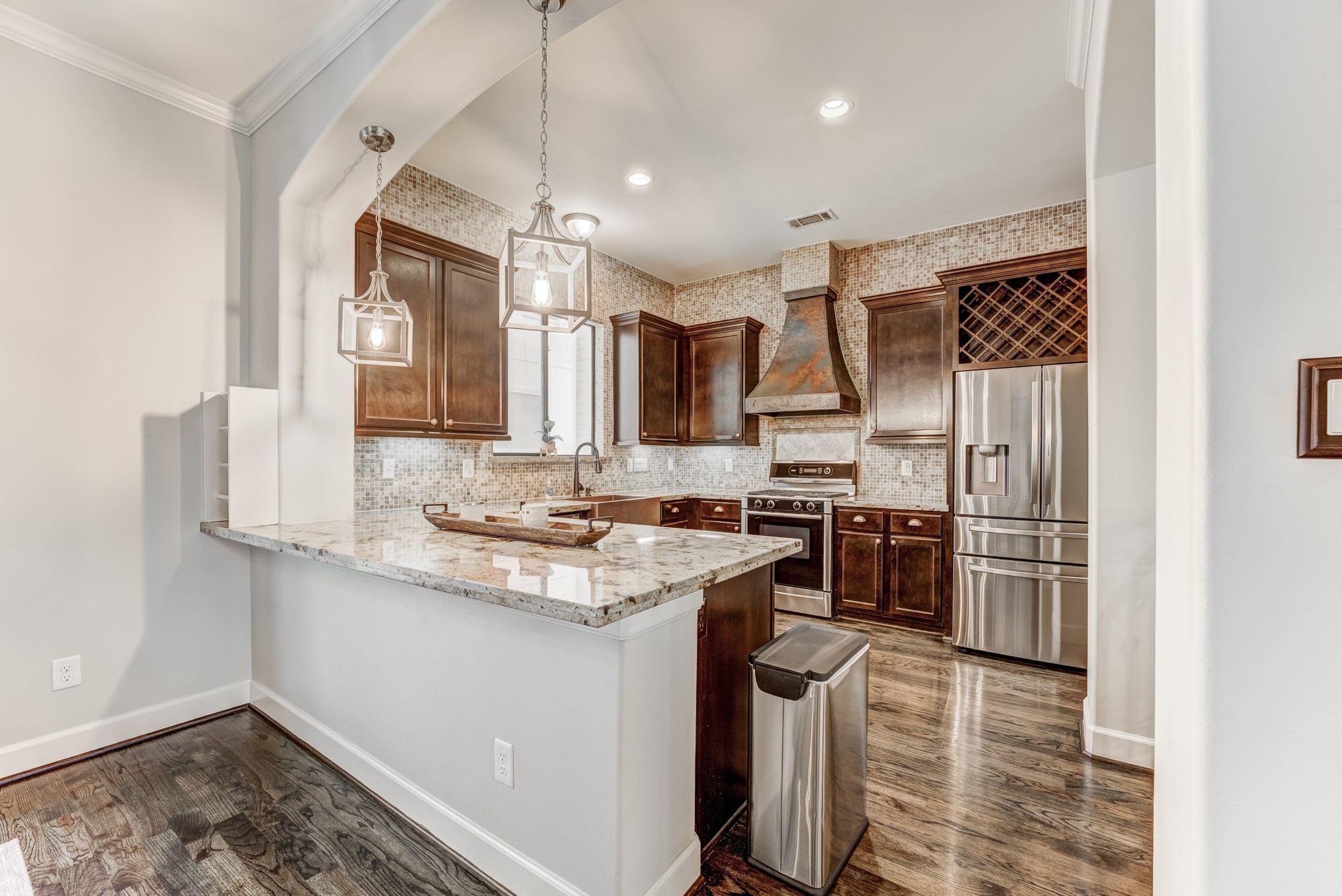 2308 Couch Street Houston, TX 77008 - Photo 18 of 50 a kitchen with a sink stove and refrigerator