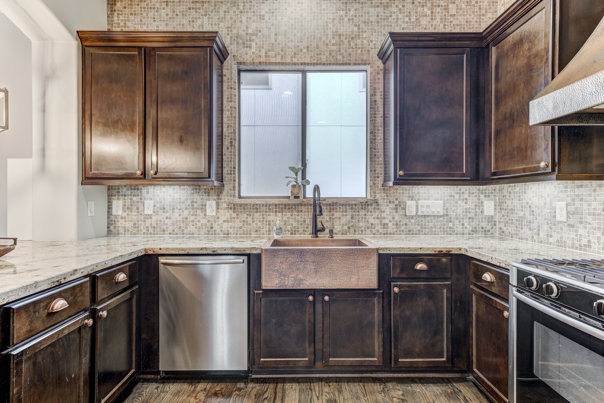2308 Couch Street Houston, TX 77008 - Photo 20 of 50 a kitchen with stainless steel appliances granite countertop a sink stove and cabinets