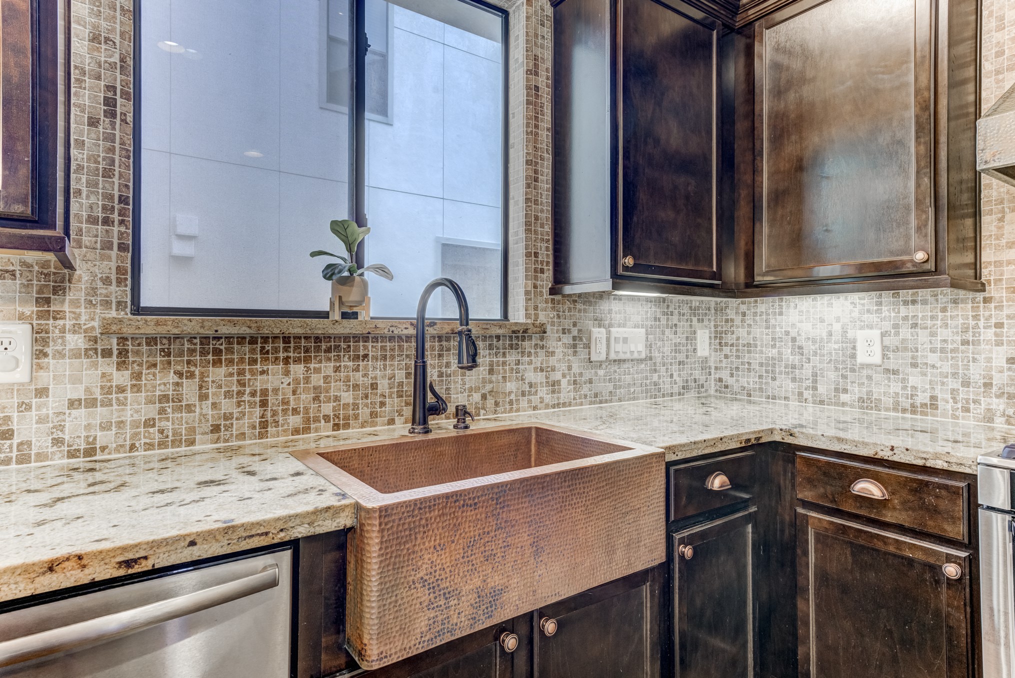 2308 Couch Street Houston, TX 77008 - Photo 22 of 50 a kitchen with a sink and cabinets