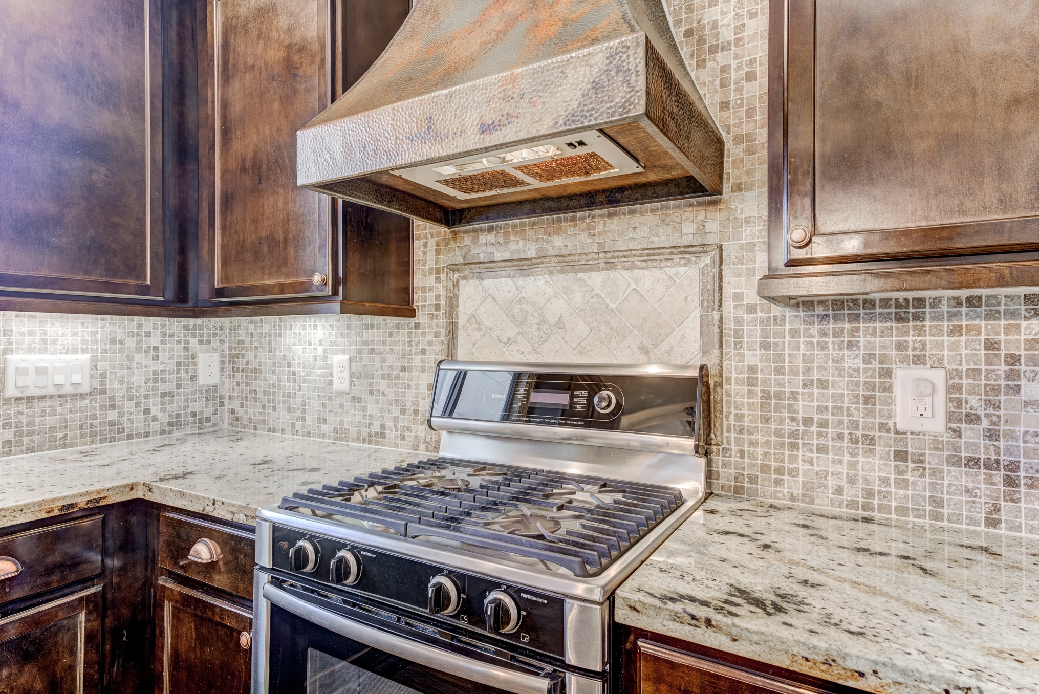 2308 Couch Street Houston, TX 77008 - Photo 23 of 50 a kitchen with a stove and cabinets