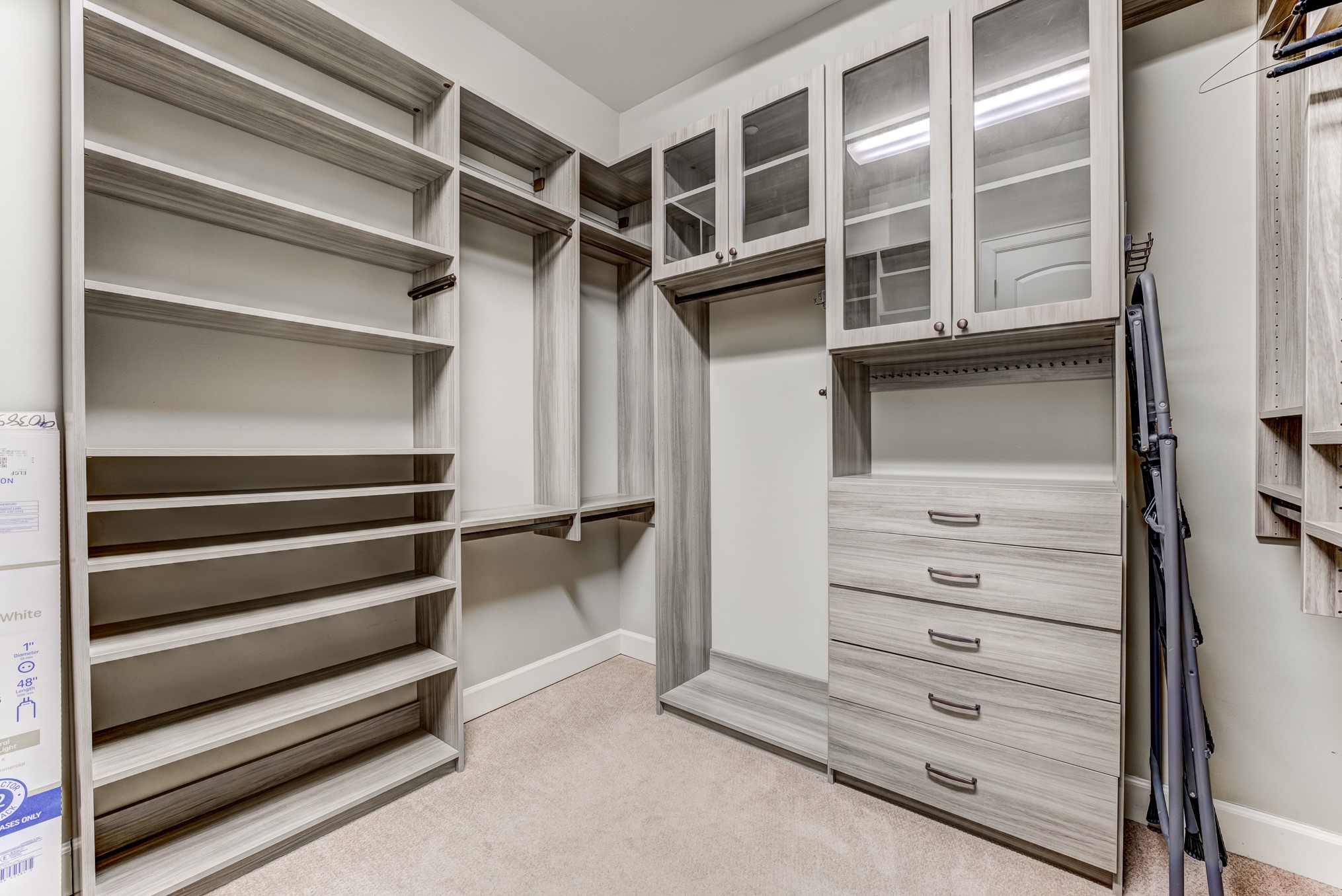 2308 Couch Street Houston, TX 77008 - Photo 34 of 50 a view of walk in closet with empty racks