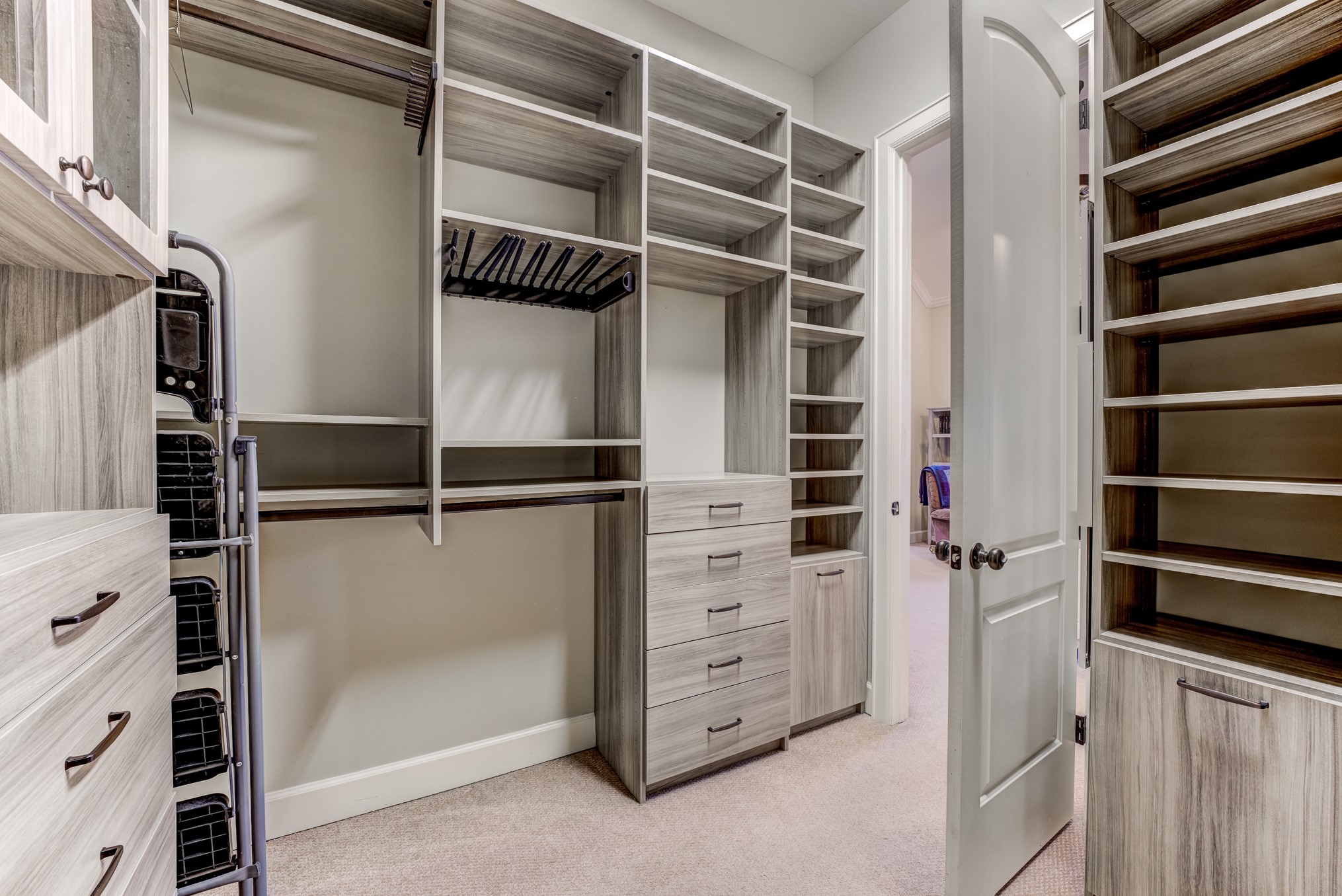 2308 Couch Street Houston, TX 77008 - Photo 35 of 50 a view of walk in closet with empty racks