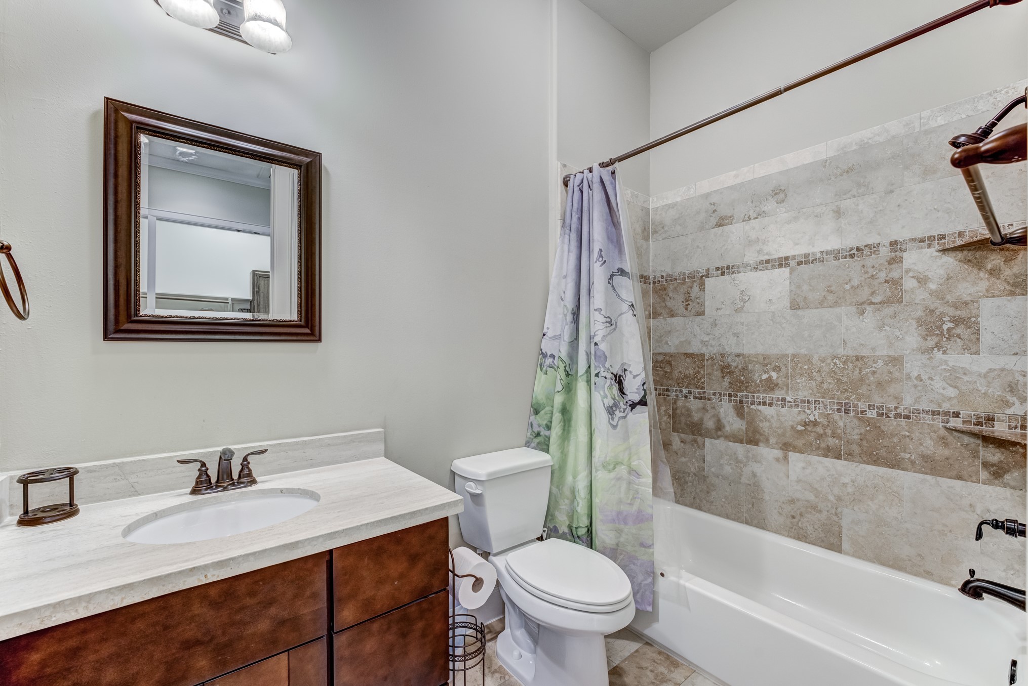2308 Couch Street Houston, TX 77008 - Photo 38 of 50 a bathroom with a granite countertop sink toilet and shower