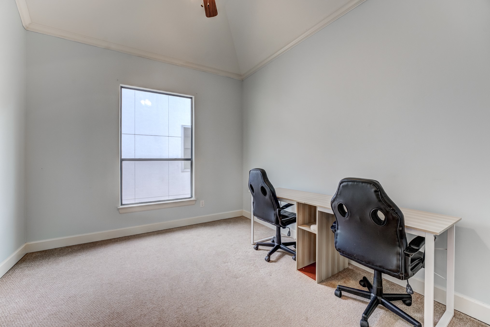 2308 Couch Street Houston, TX 77008 - Photo 39 of 50 a view of a workspace with furniture and a window