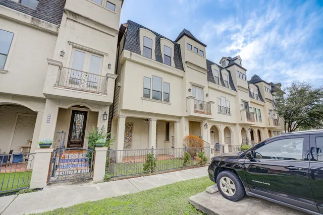 a living room with furniture fireplace and flat screen tv
