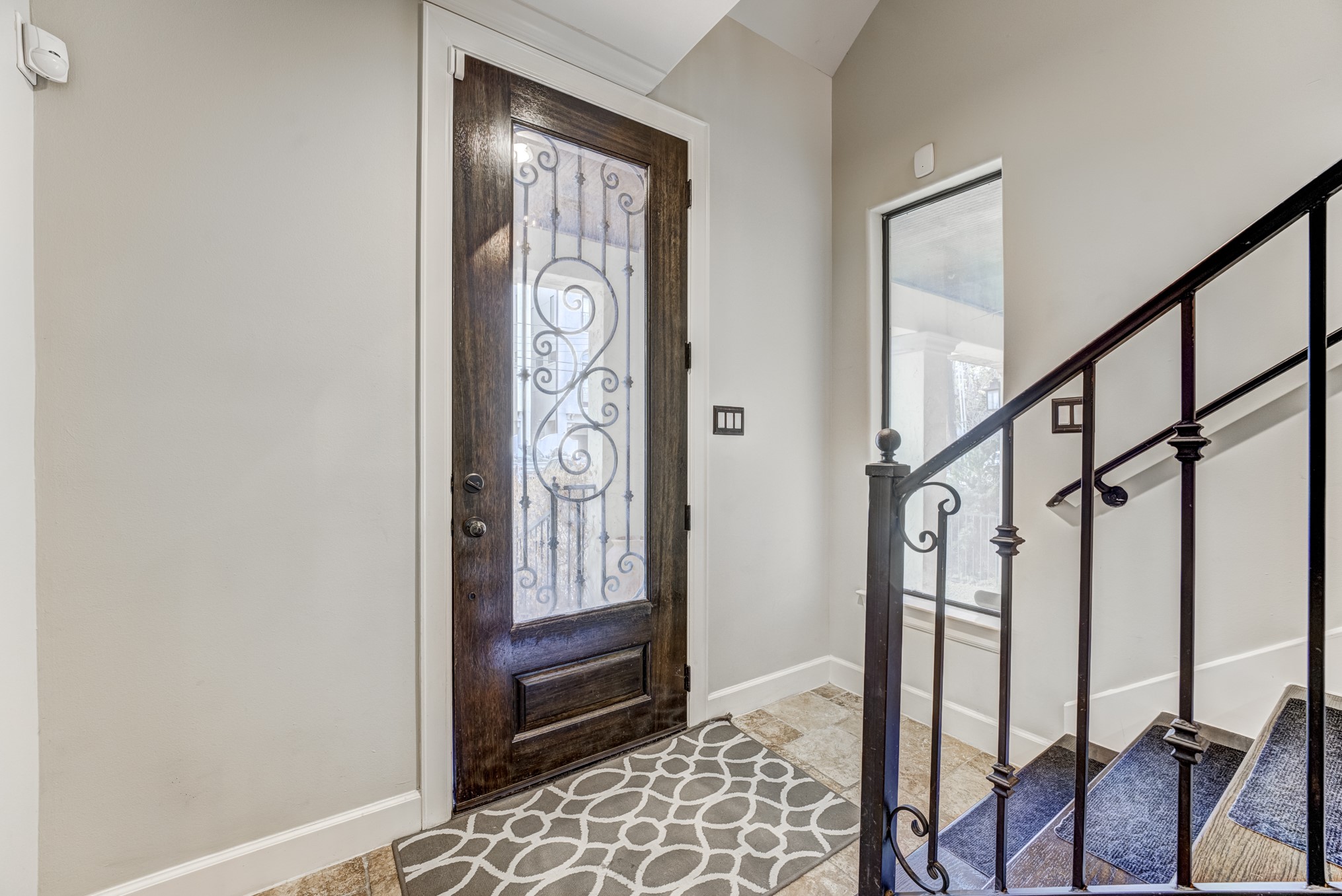 2308 Couch Street Houston, TX 77008 - Photo 9 of 50 a view of an entryway with wooden floor and door