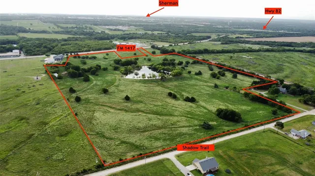 a view of lake with huge green field