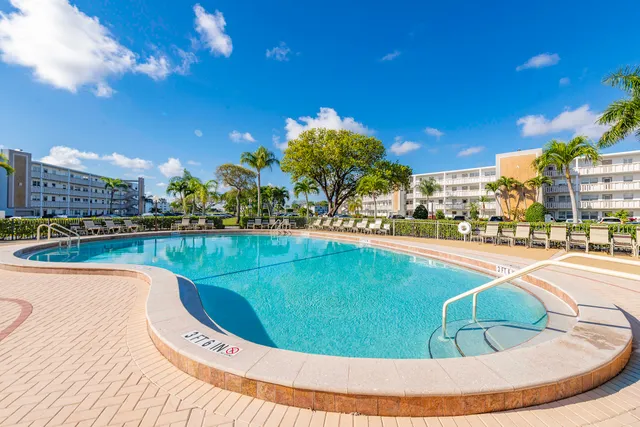 a view of a swimming pool and a chairs