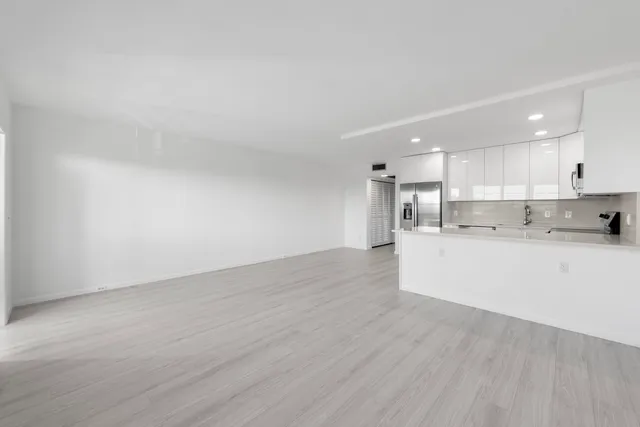 a view of kitchen with wooden floor