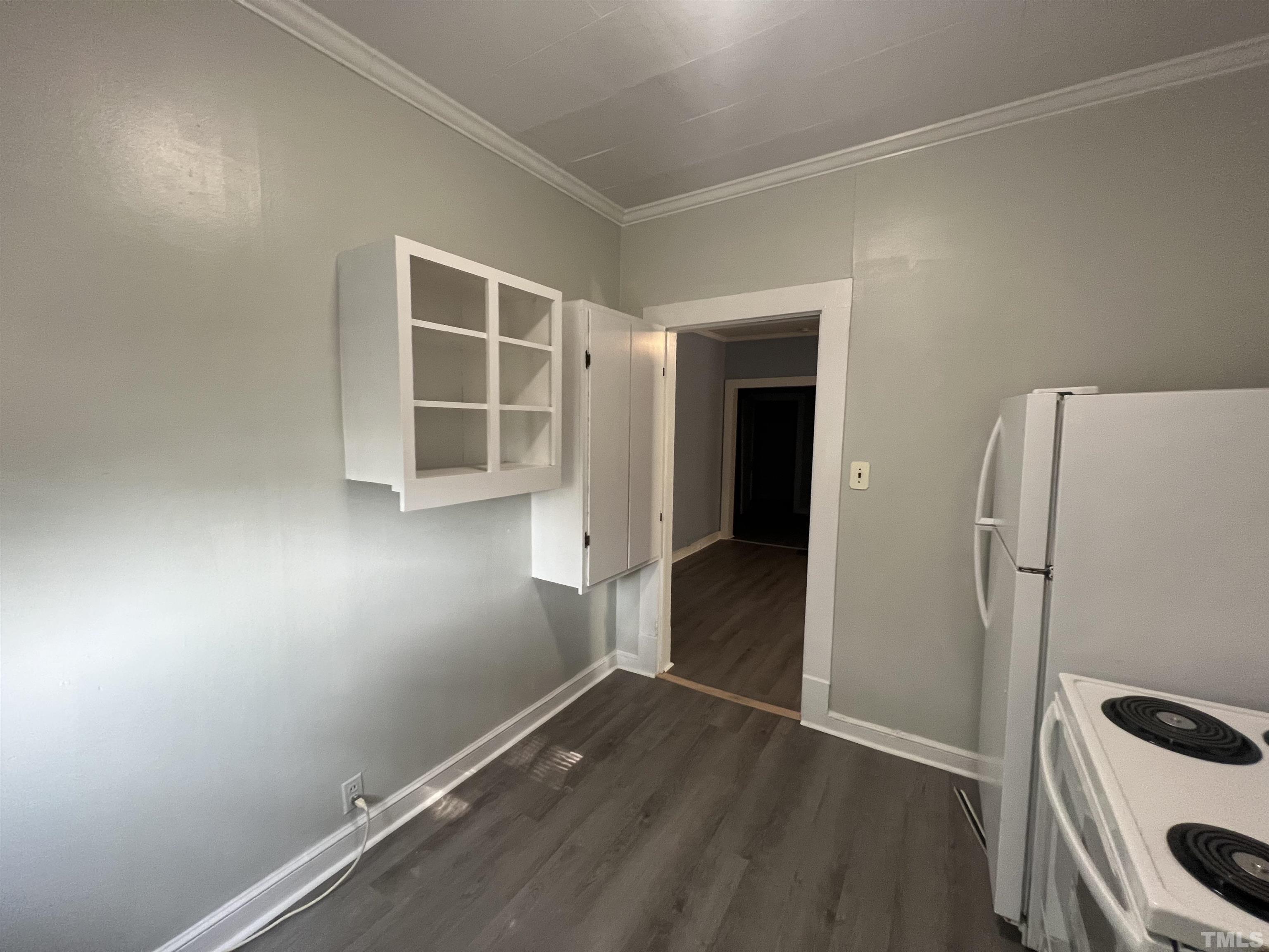 2501 Pickett Road, Unit 5 Durham, NC 27705 - Photo 12 of 17 an empty room with wooden floor and window