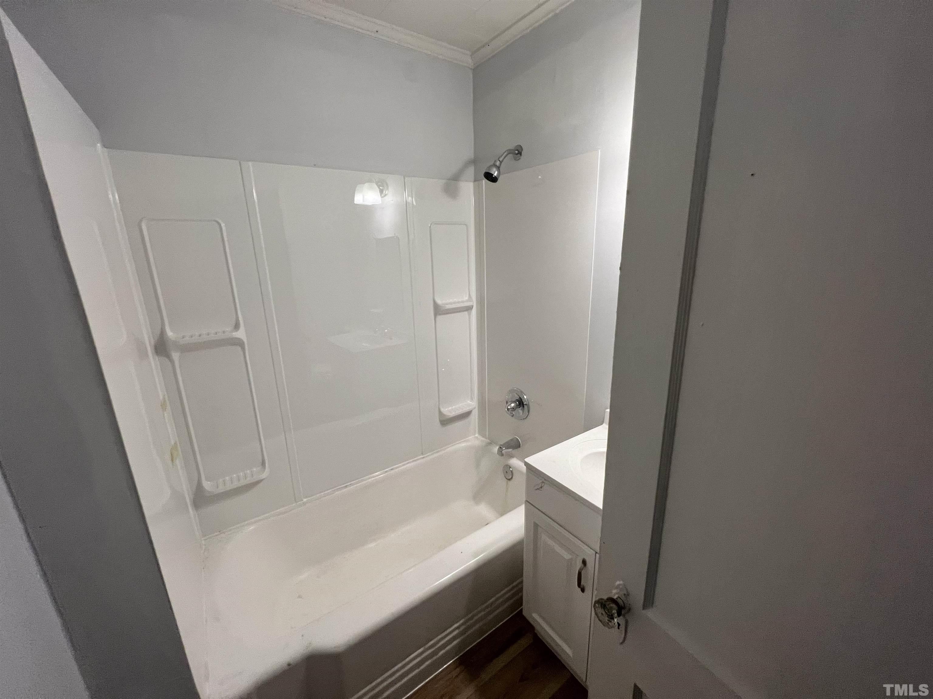 2501 Pickett Road, Unit 5 Durham, NC 27705 - Photo 15 of 17 a bathroom with a bathtub and shower