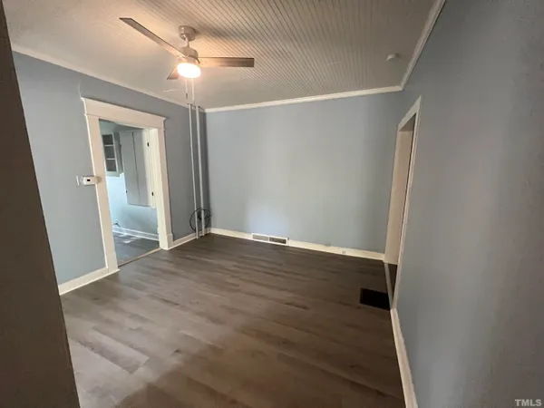 a kitchen with granite countertop a stove and a refrigerator