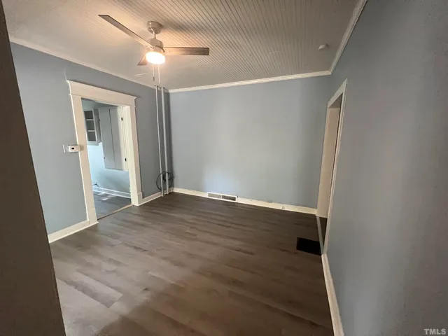a kitchen with granite countertop a stove and a refrigerator