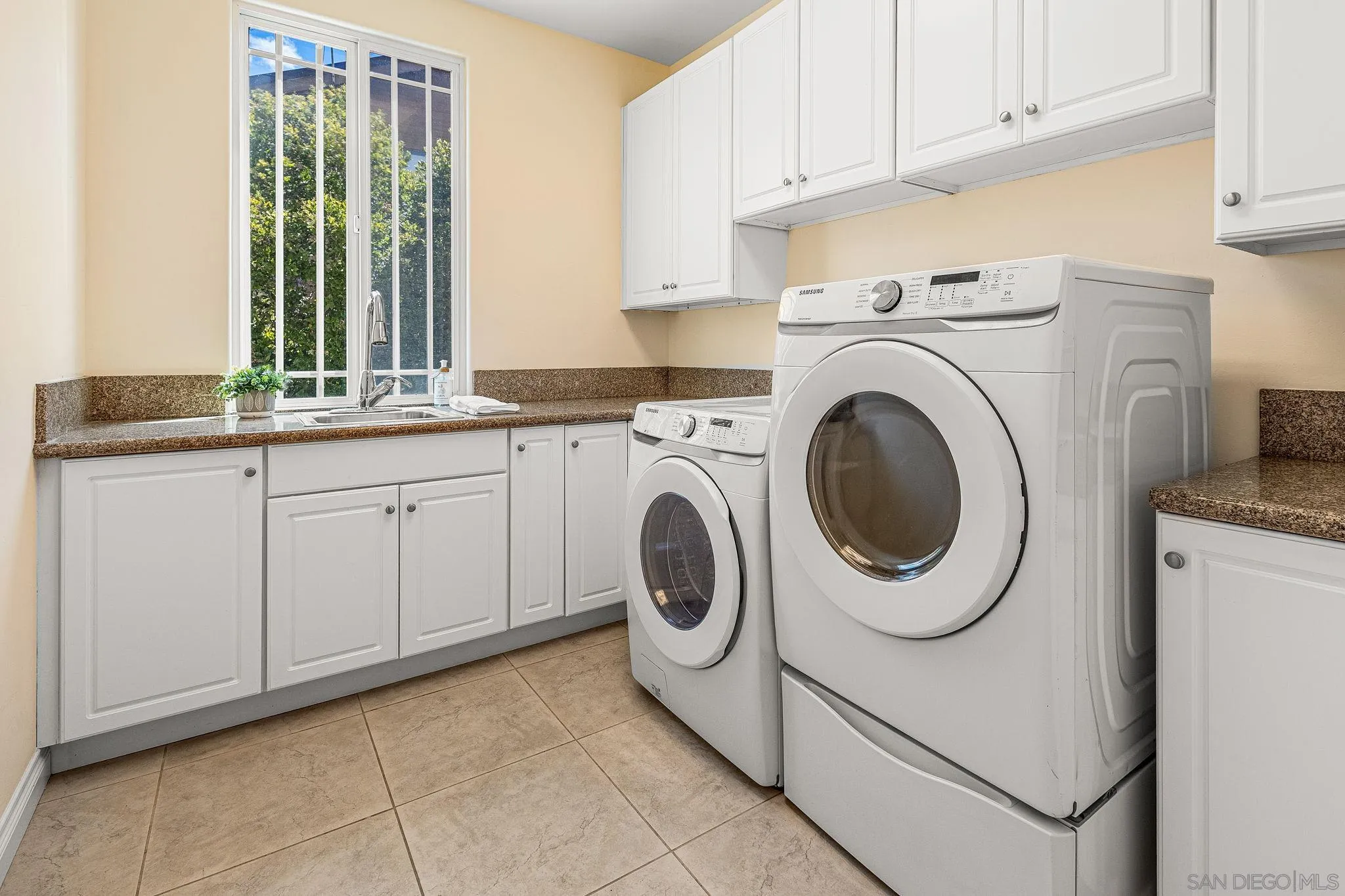 25919 Matlin Road Ramona, CA 92065 - Photo 11 of 42 a utility room with sink dryer and washer