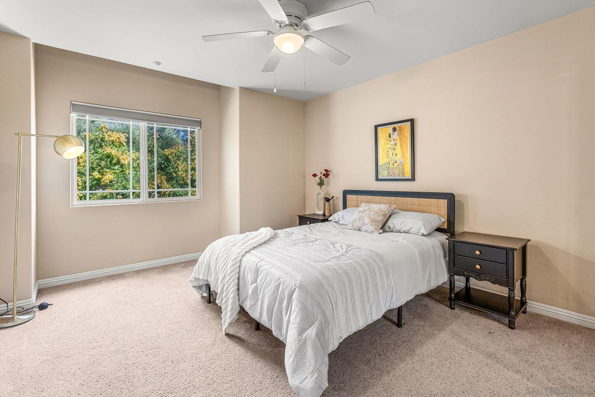 25919 Matlin Road Ramona, CA 92065 - Photo 16 of 42 a bedroom with a bed and a chandelier