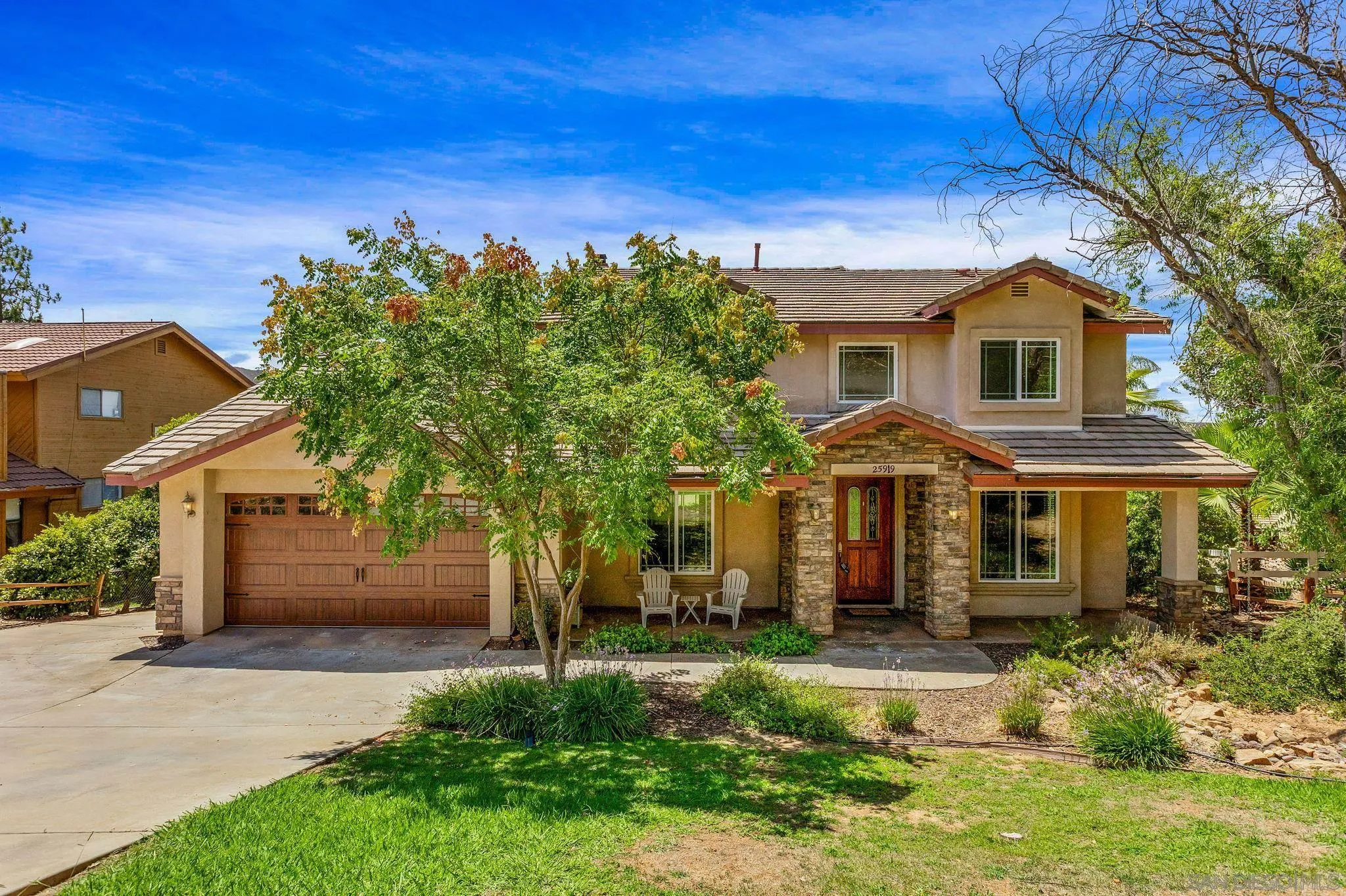 25919 Matlin Road Ramona, CA 92065 - Photo 2 of 42 front view of a house with a yard