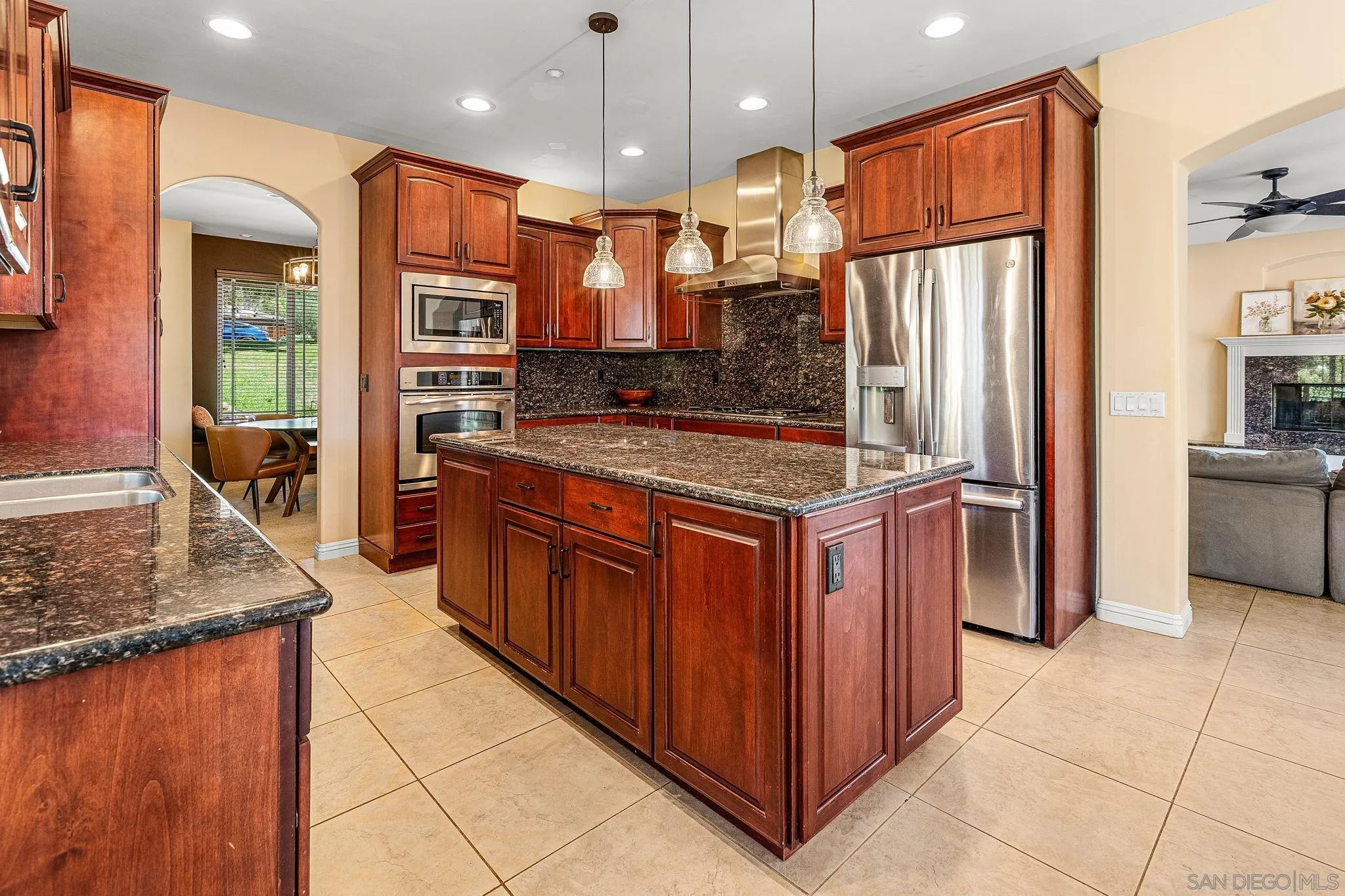 25919 Matlin Road Ramona, CA 92065 - Photo 3 of 42 a kitchen with stainless steel appliances granite countertop a stove a refrigerator and a oven
