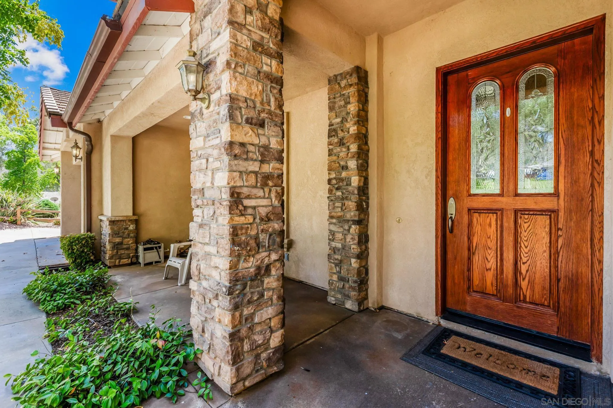 25919 Matlin Road Ramona, CA 92065 - Photo 32 of 42 front view of a entryway with brick walls