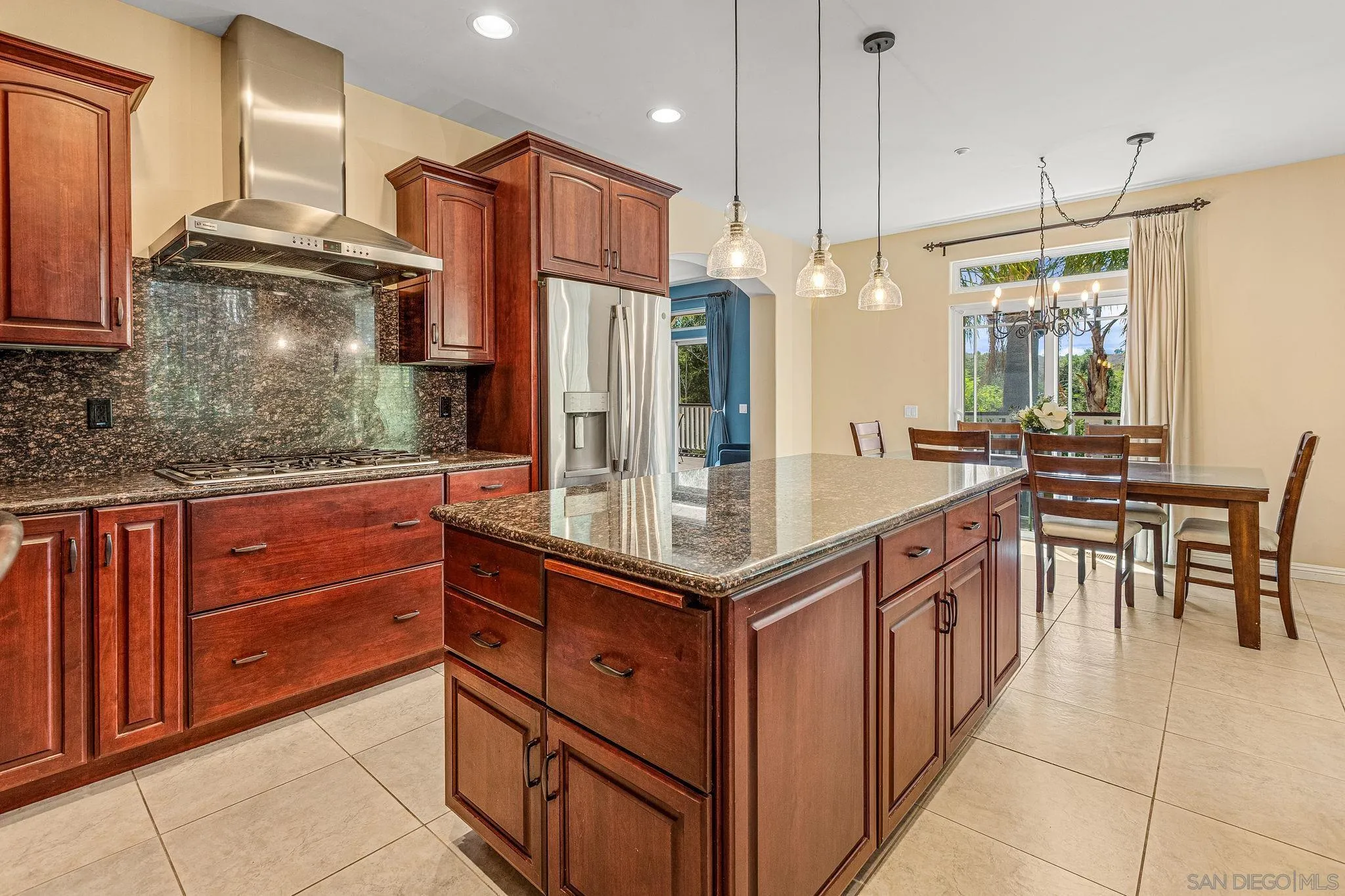 25919 Matlin Road Ramona, CA 92065 - Photo 33 of 42 a kitchen with stainless steel appliances granite countertop a sink and a refrigerator