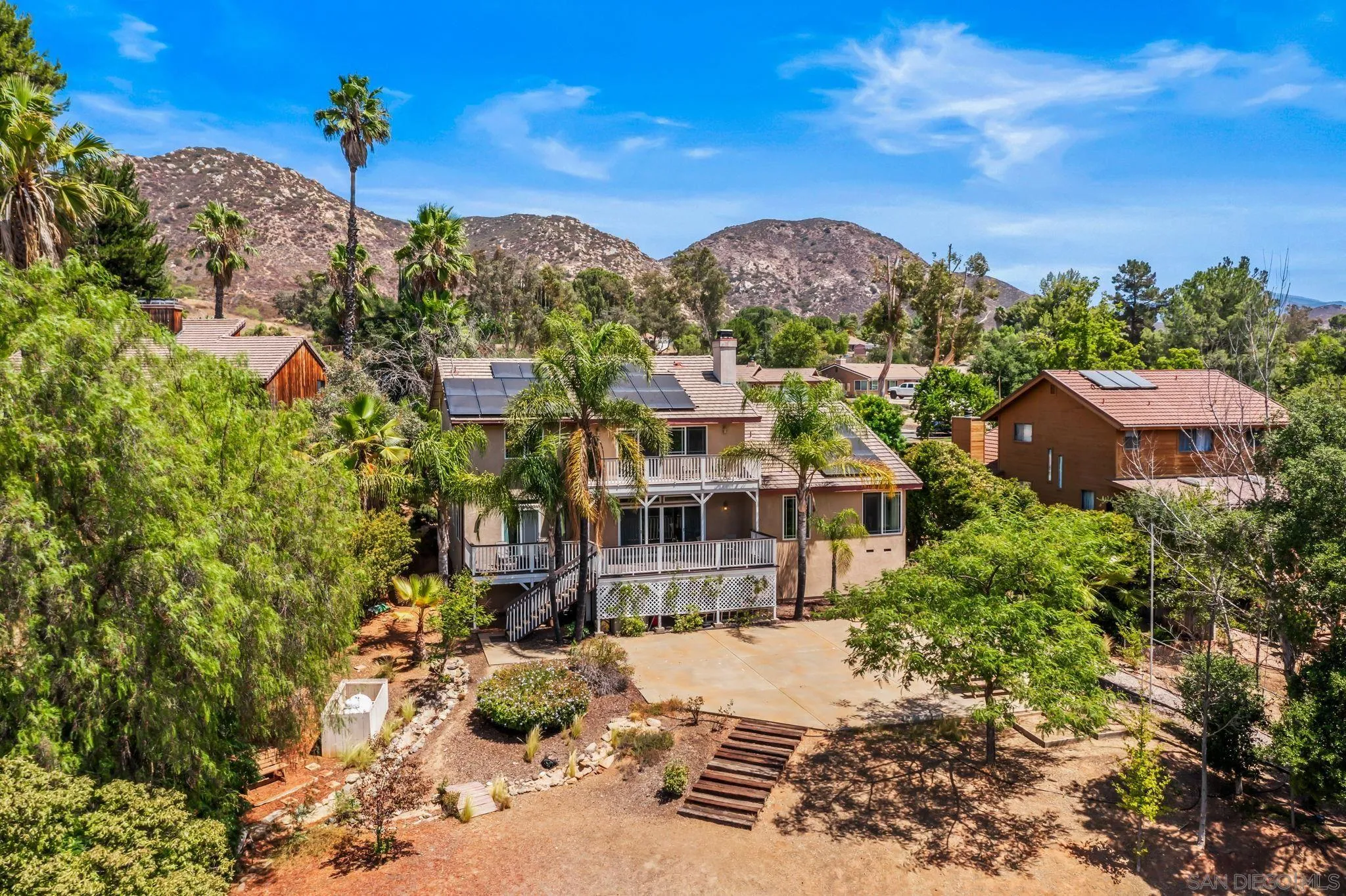 25919 Matlin Road Ramona, CA 92065 - Photo 34 of 42 a view of a house with a yard and sitting area