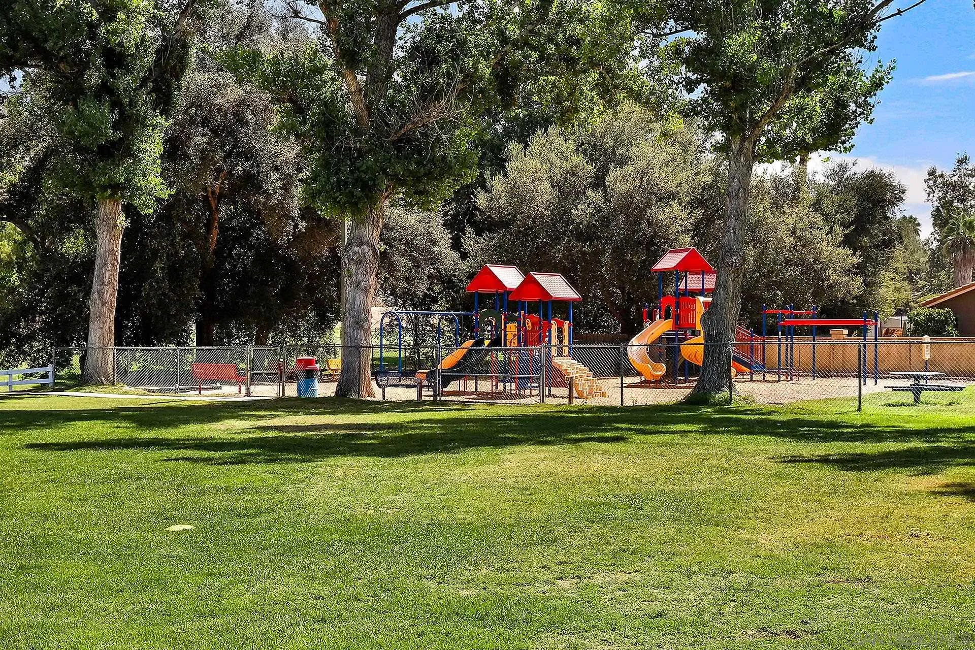 25919 Matlin Road Ramona, CA 92065 - Photo 38 of 42 a childrens park with lots of swings and slides