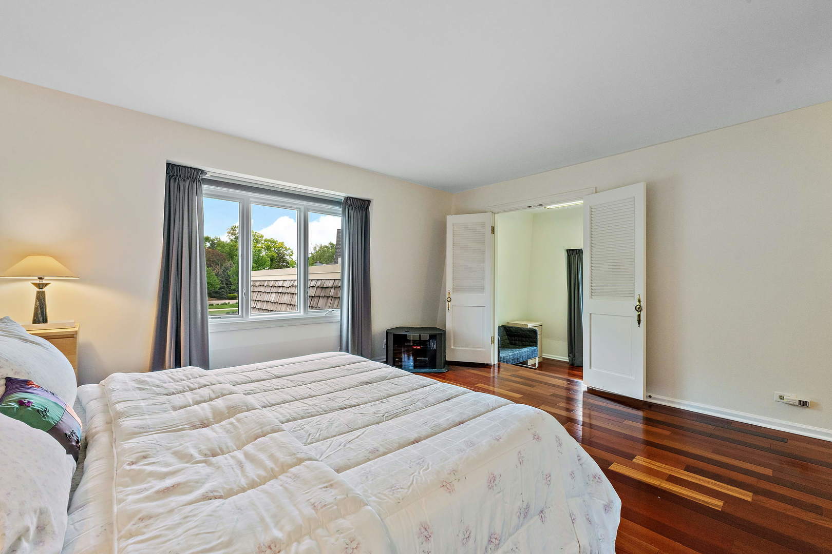 9 Hampton Drive Oak Brook, IL 60523 - Photo 13 of 27 a bedroom with a bed and a large window