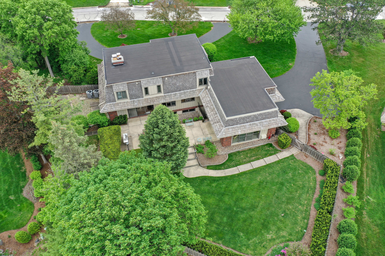9 Hampton Drive Oak Brook, IL 60523 - Photo 2 of 27 an aerial view of a house with a big yard and large trees