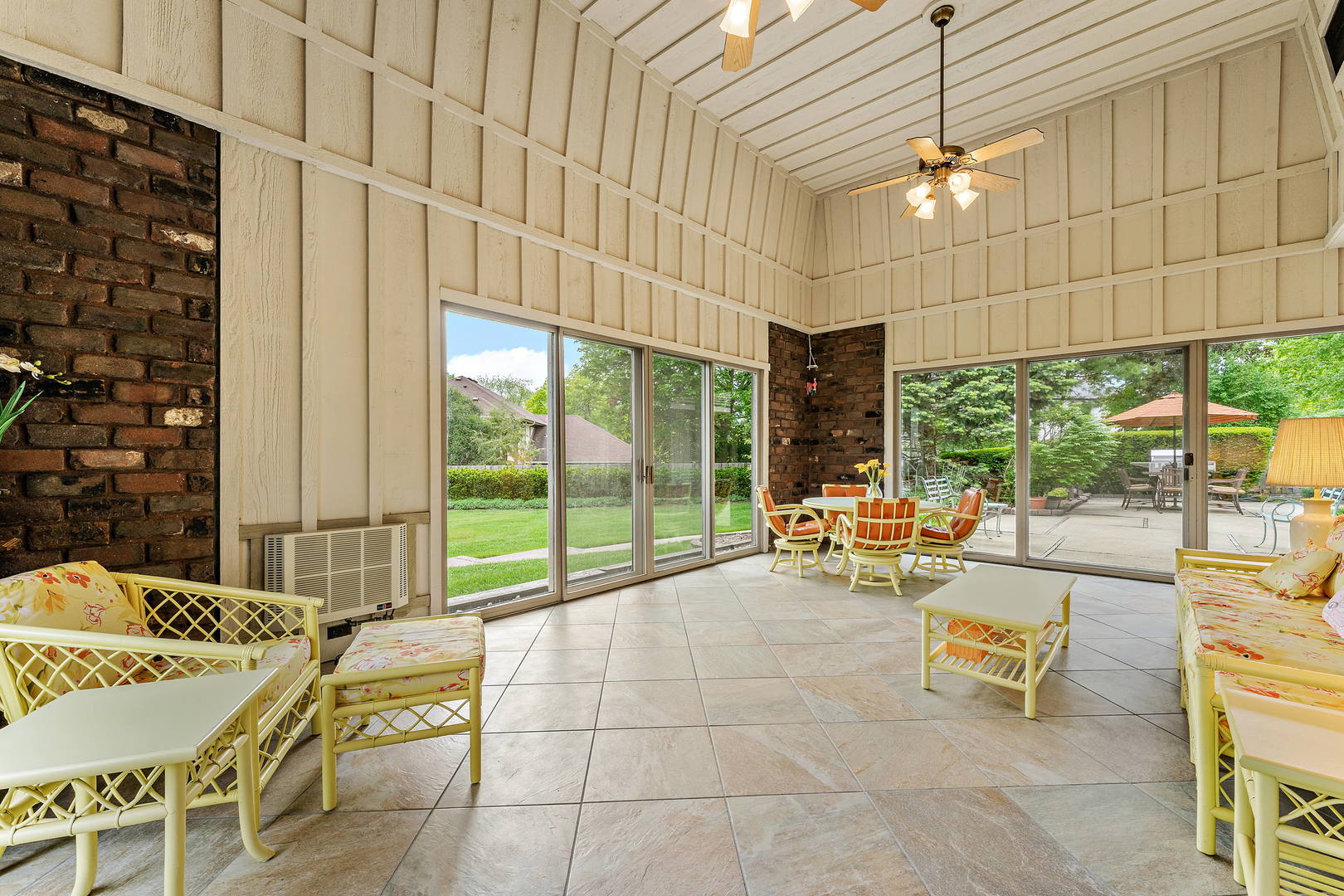 9 Hampton Drive Oak Brook, IL 60523 - Photo 4 of 27 a view of a patio with a table and chairs and potted plants