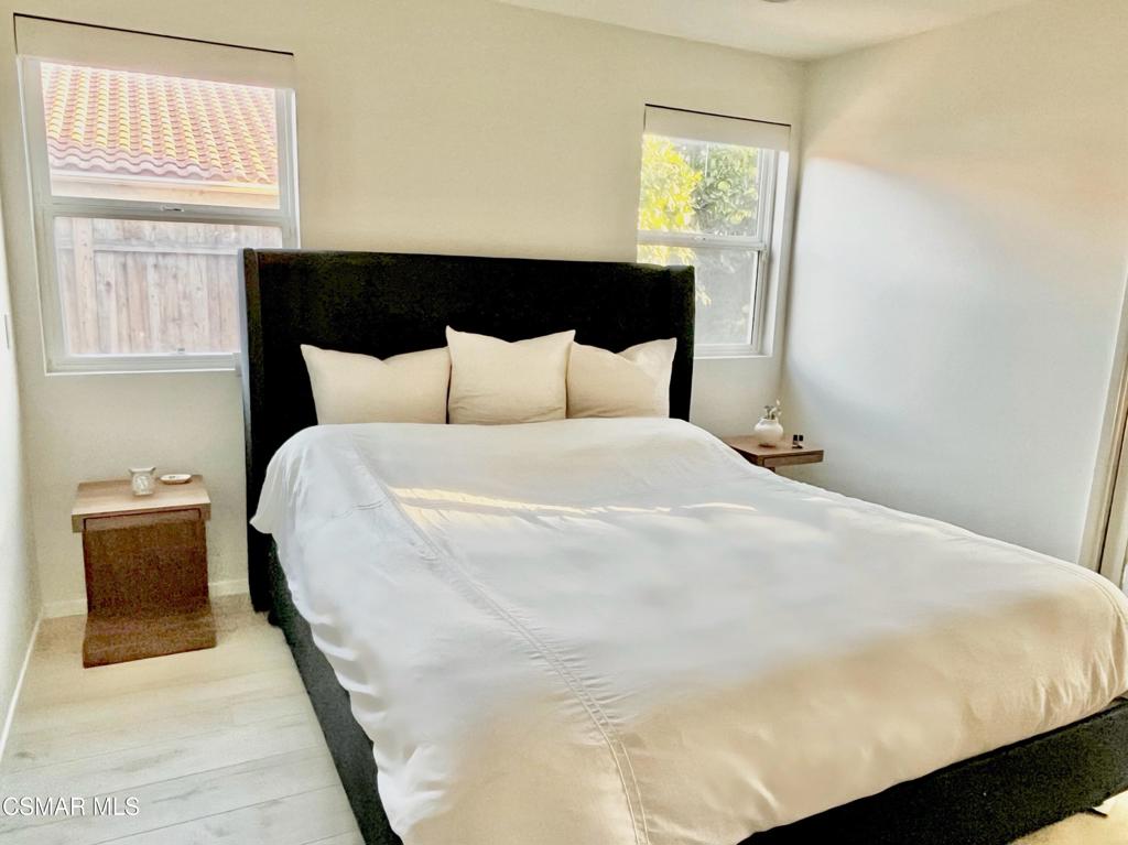 1594 Willowbrook Lane Simi Valley, CA 93065 - Photo 12 of 20 a large white bed in a bedroom next to a window