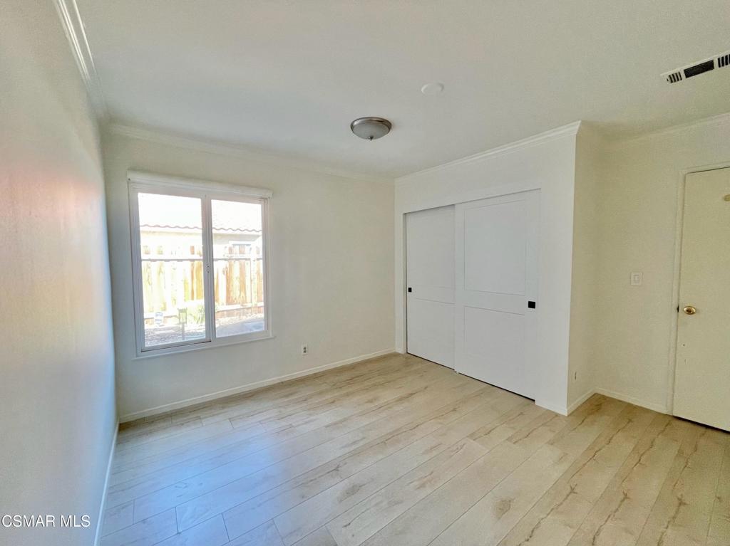 1594 Willowbrook Lane Simi Valley, CA 93065 - Photo 15 of 20 a view of an empty room with wooden floor and a window