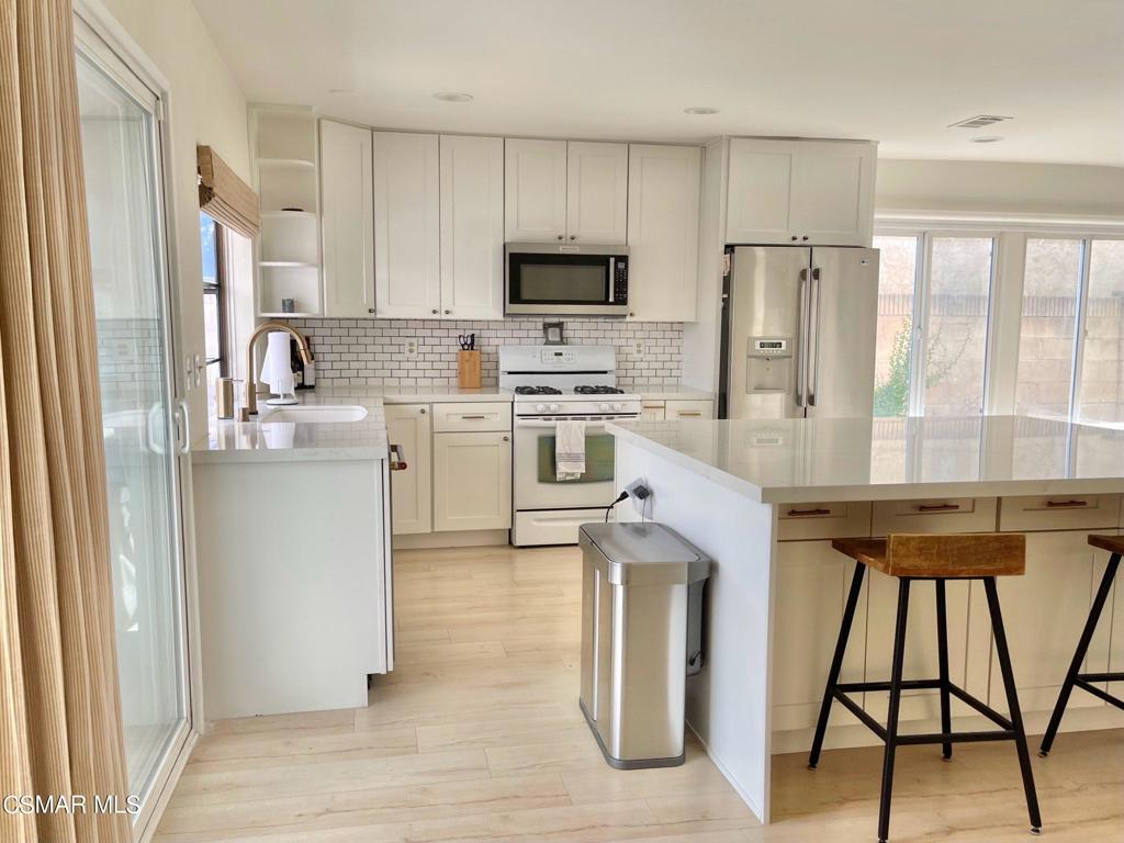 1594 Willowbrook Lane Simi Valley, CA 93065 - Photo 6 of 20 a kitchen with stainless steel appliances granite countertop a refrigerator sink and stove