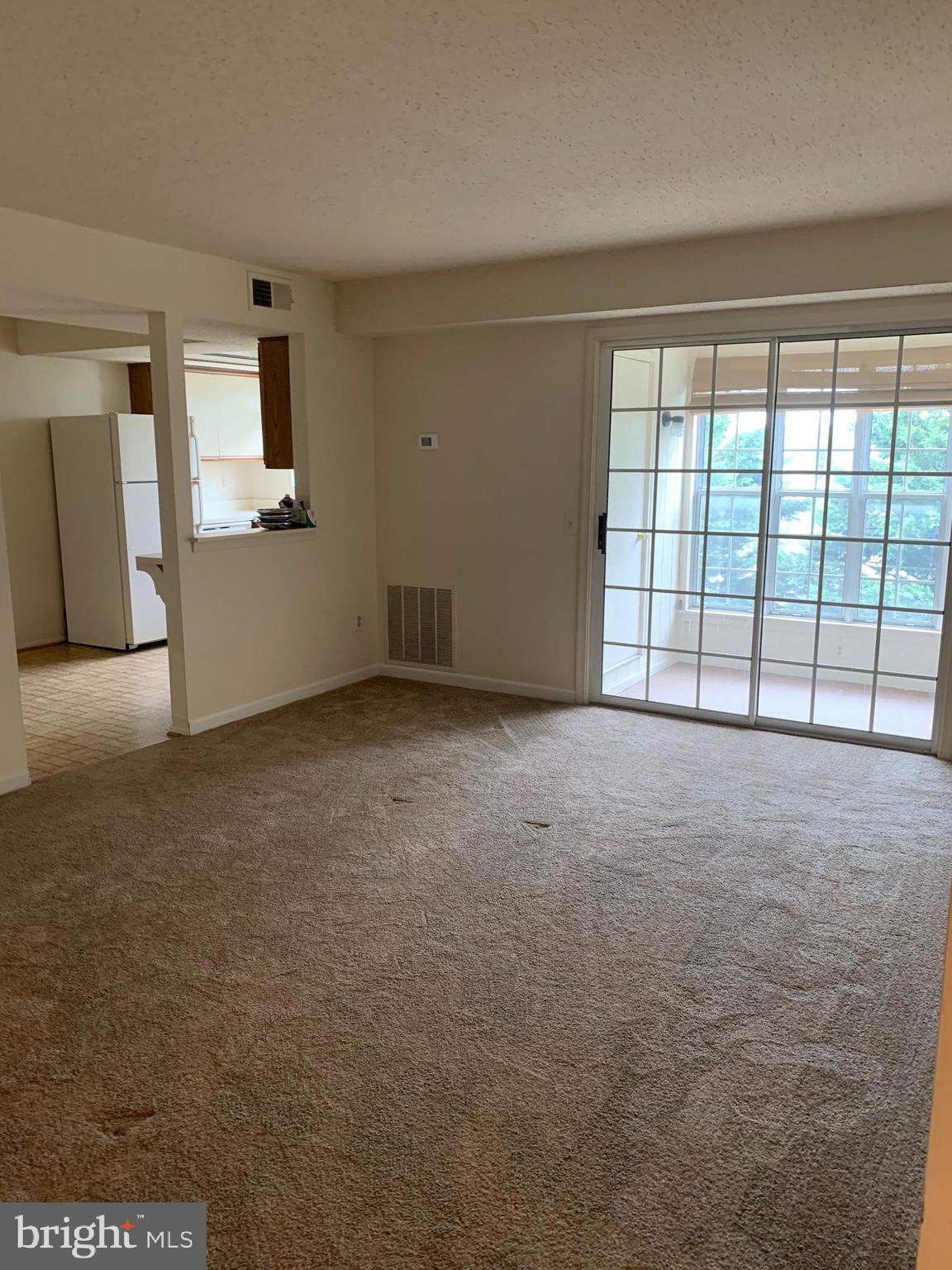 119 Fort Evans Road Southeast, Unit C Leesburg, VA 20175 - Photo 13 of 18 living room looking into kitchen
