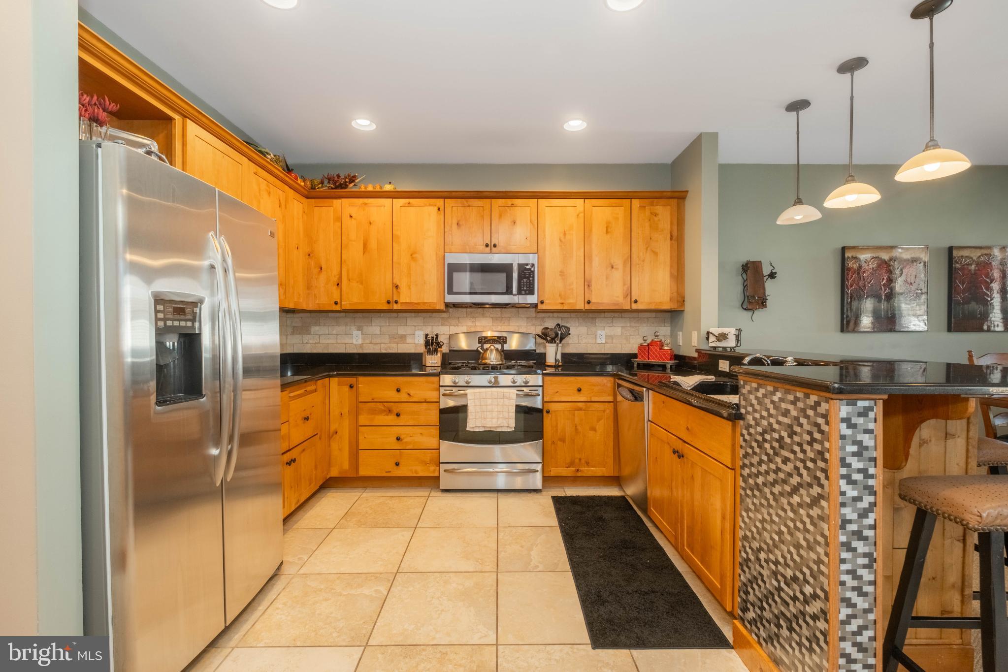 14 Ridge Run Road McHenry, MD 21541 - Photo 11 of 65 Warm wood tones in a modern kitchen space.